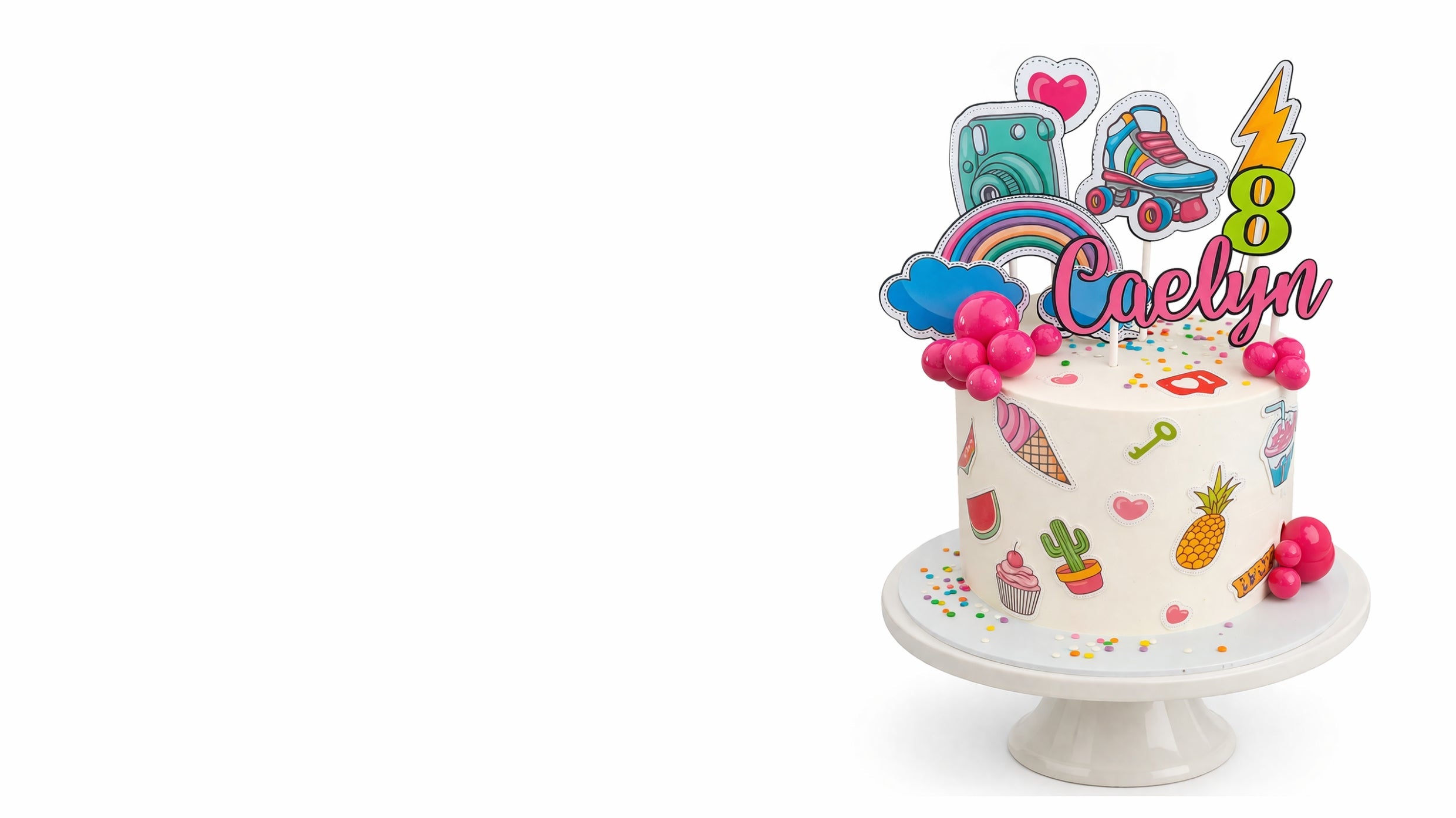 Custom kids birthday cake with colourful decorations, name topper and age number on white cake stand in Johannesburg