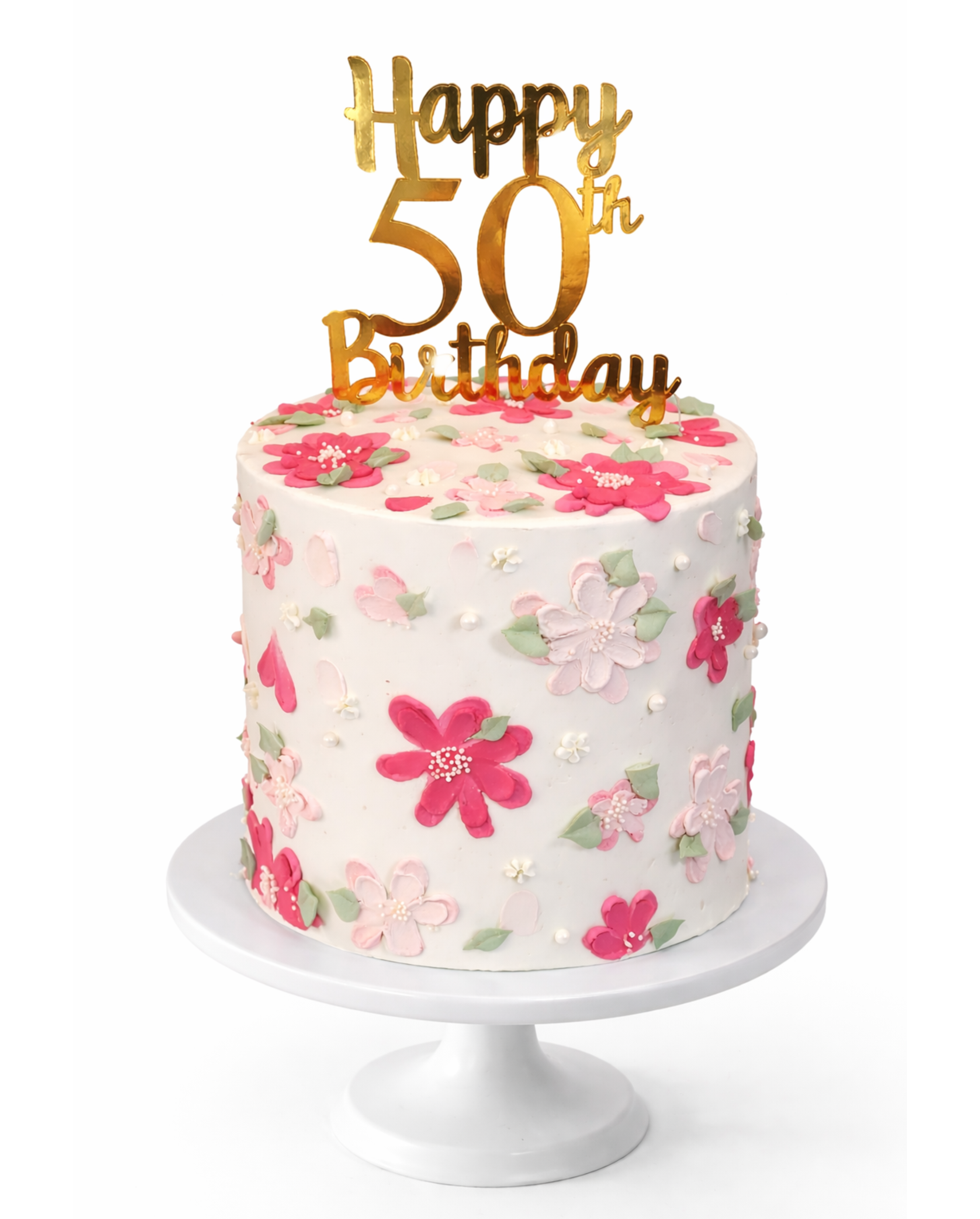 Elegant pink floral cake with hand-piped blossoms and greenery finished in white chocolate ganache on white cake stand
