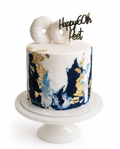 Luxury navy blue and gold brushstroke cake with white chocolate ganache finish and custom birthday topper on white cake stand