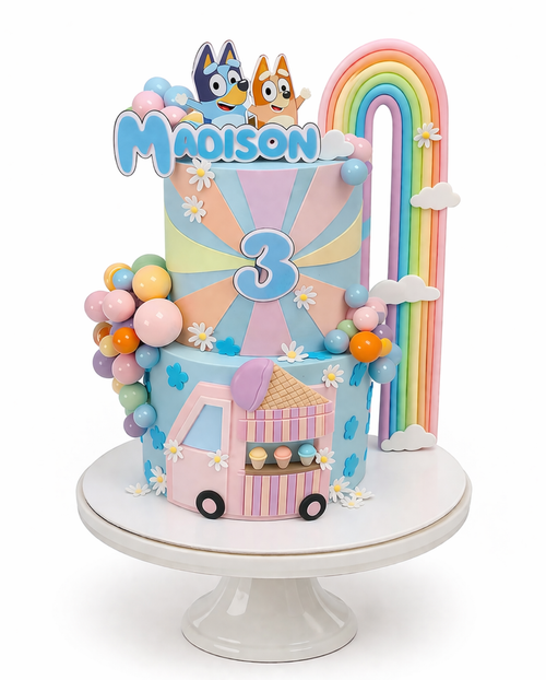 Two-tier Bluey themed birthday cake with pastel colours, rainbow decoration, ice cream cart design and custom name topper on white cake stand