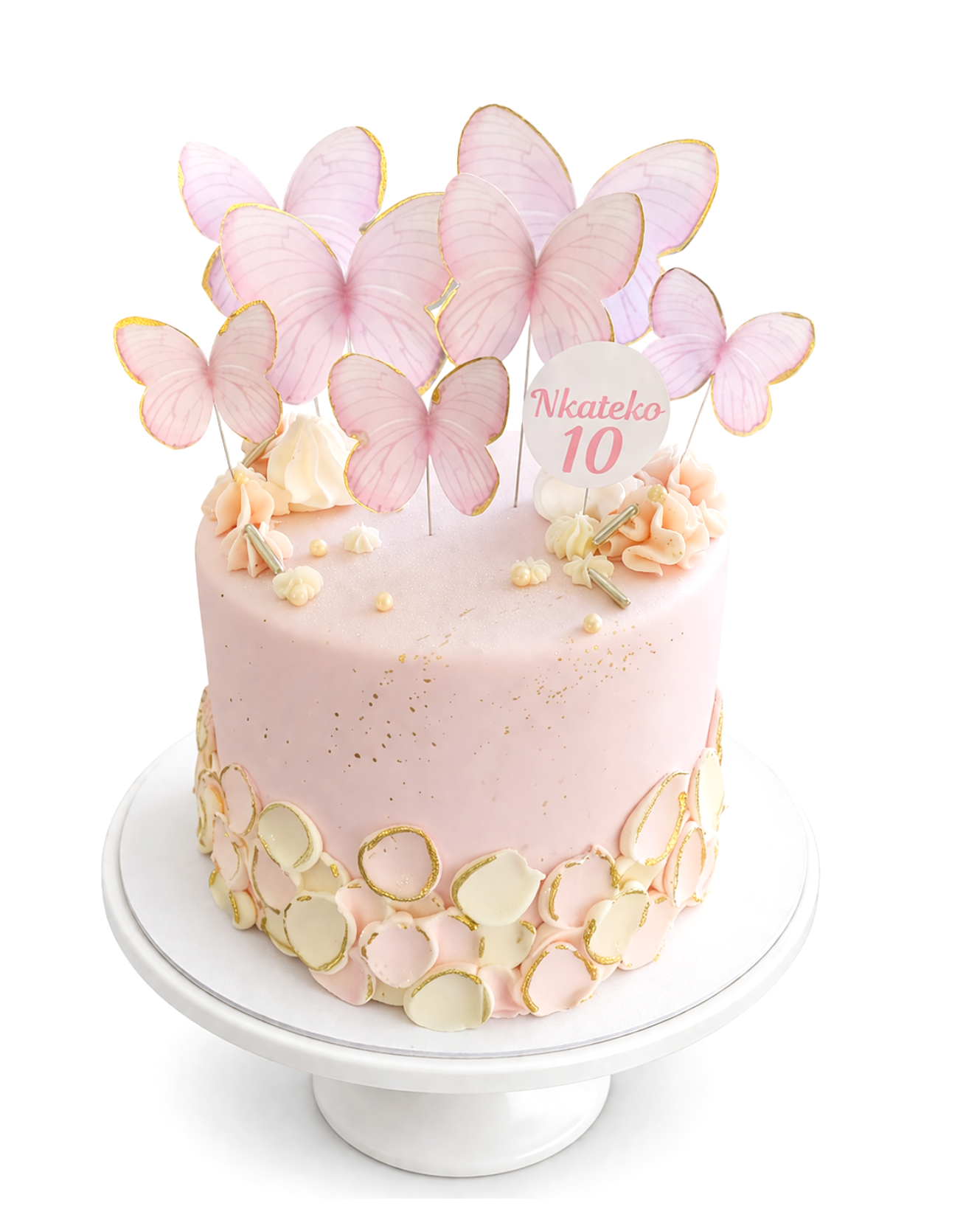 Butterfly themed blush pink cake with gold accents and delicate butterfly decorations finished in white chocolate ganache on white cake stand