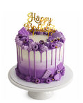 Purple ombre drip cake with piped swirls and gold topper finished in white chocolate ganache on white cake stand