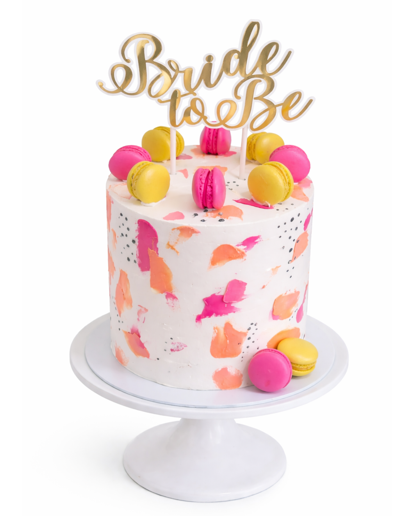 Pink brushstroke cake with macarons and modern design finished in white chocolate ganache on white cake stand