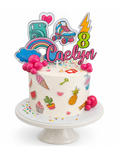 Colourful whimsical themed cake with rainbows, sweets and playful decorations finished in white chocolate ganache on white cake stand